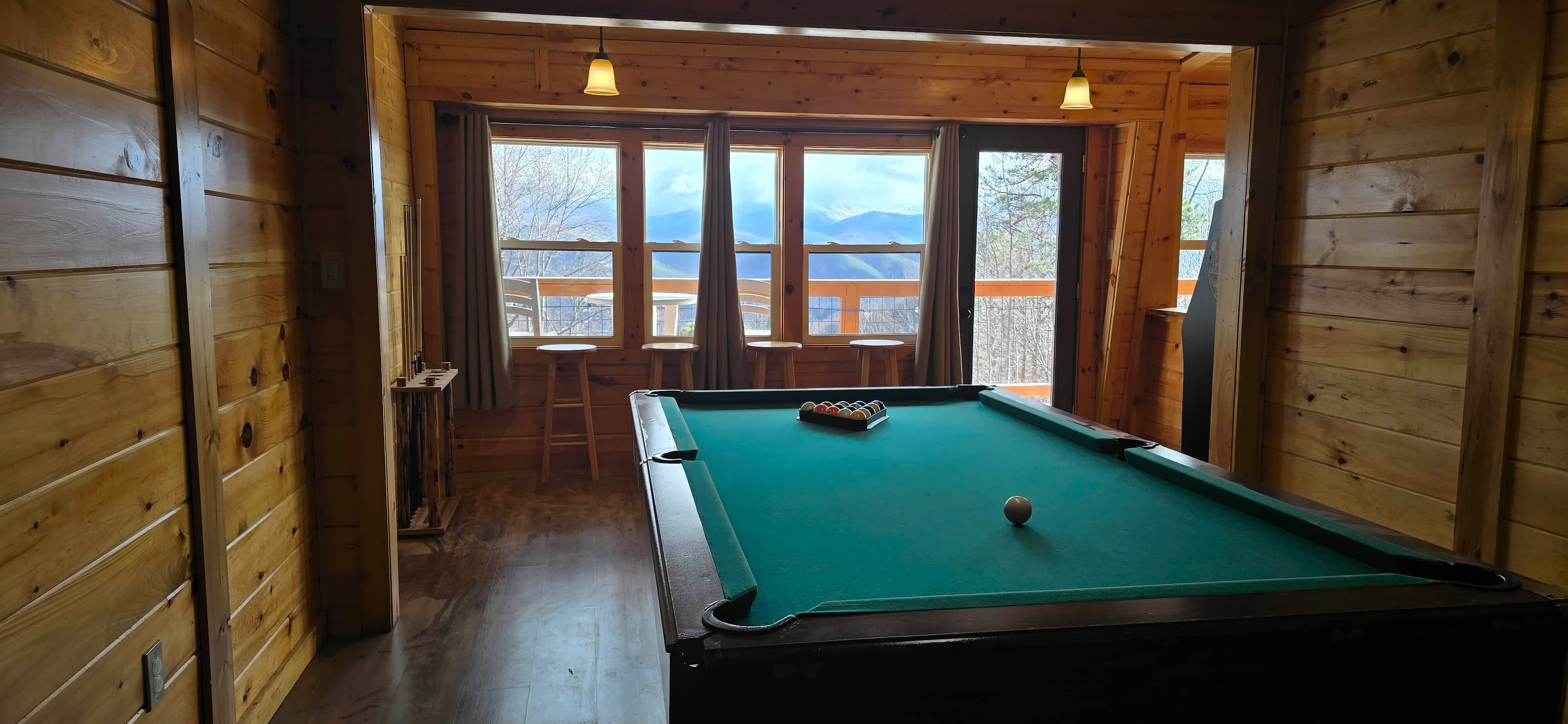 Pool table with mountain view at Honey Bear Lodge