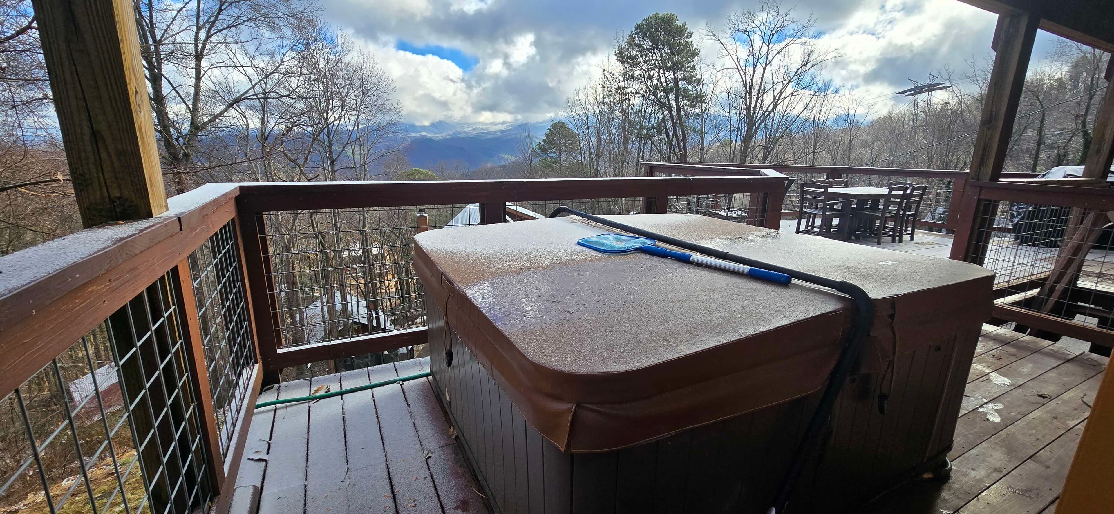 Private hot tub on the deck at Honey Bear Lodge