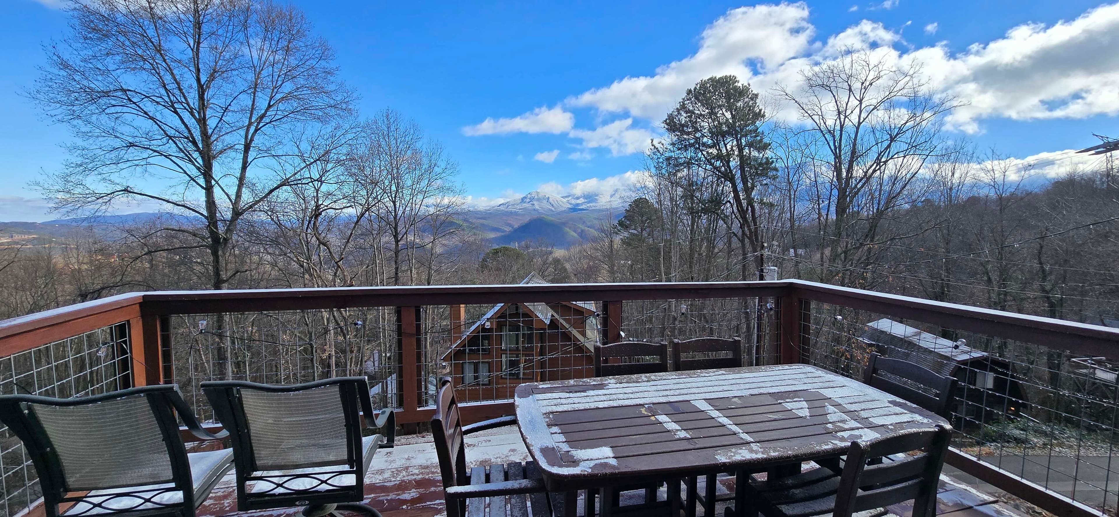 Snowy mountain view from the deck at Honey Bear Lodge