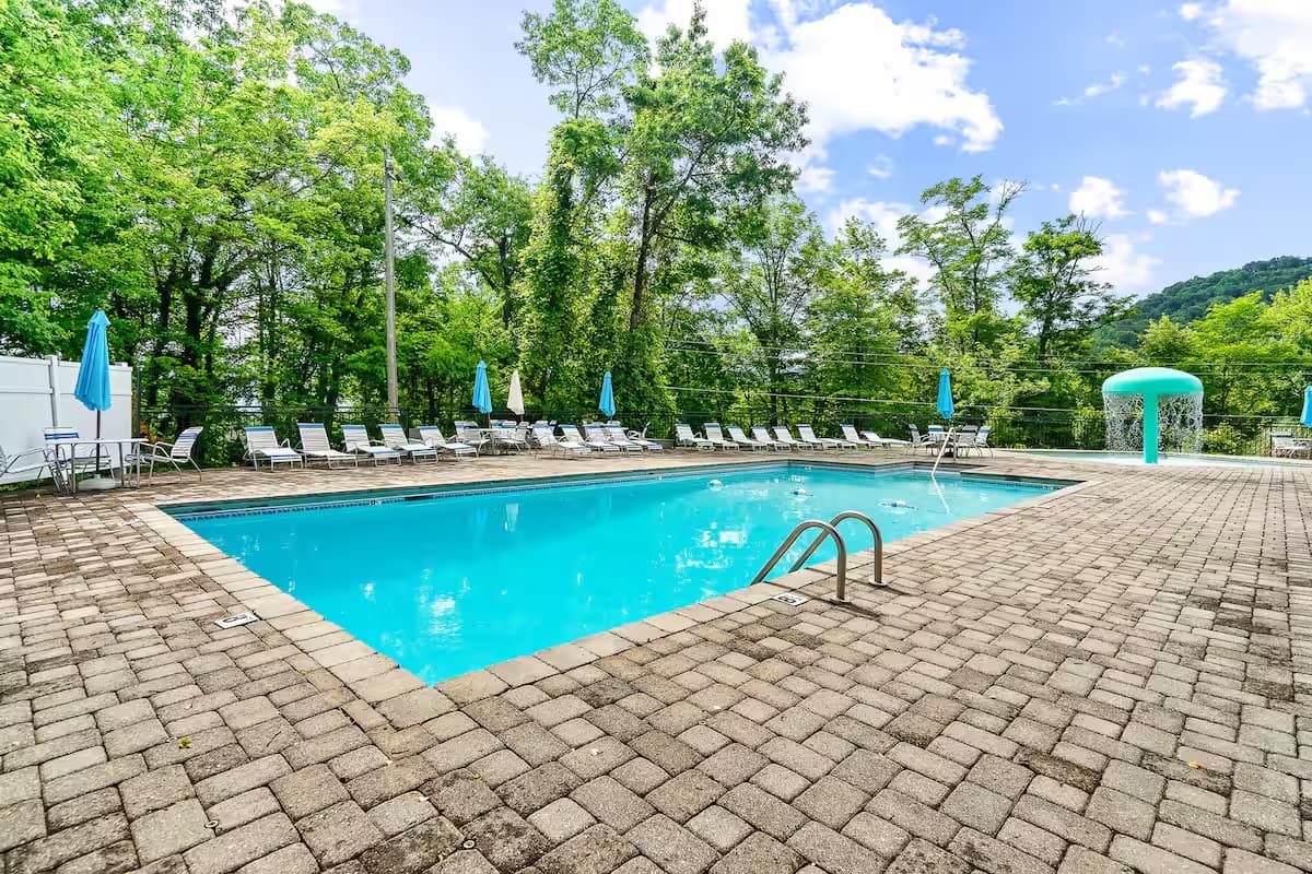 Chalet Village pool complex with tennis courts
