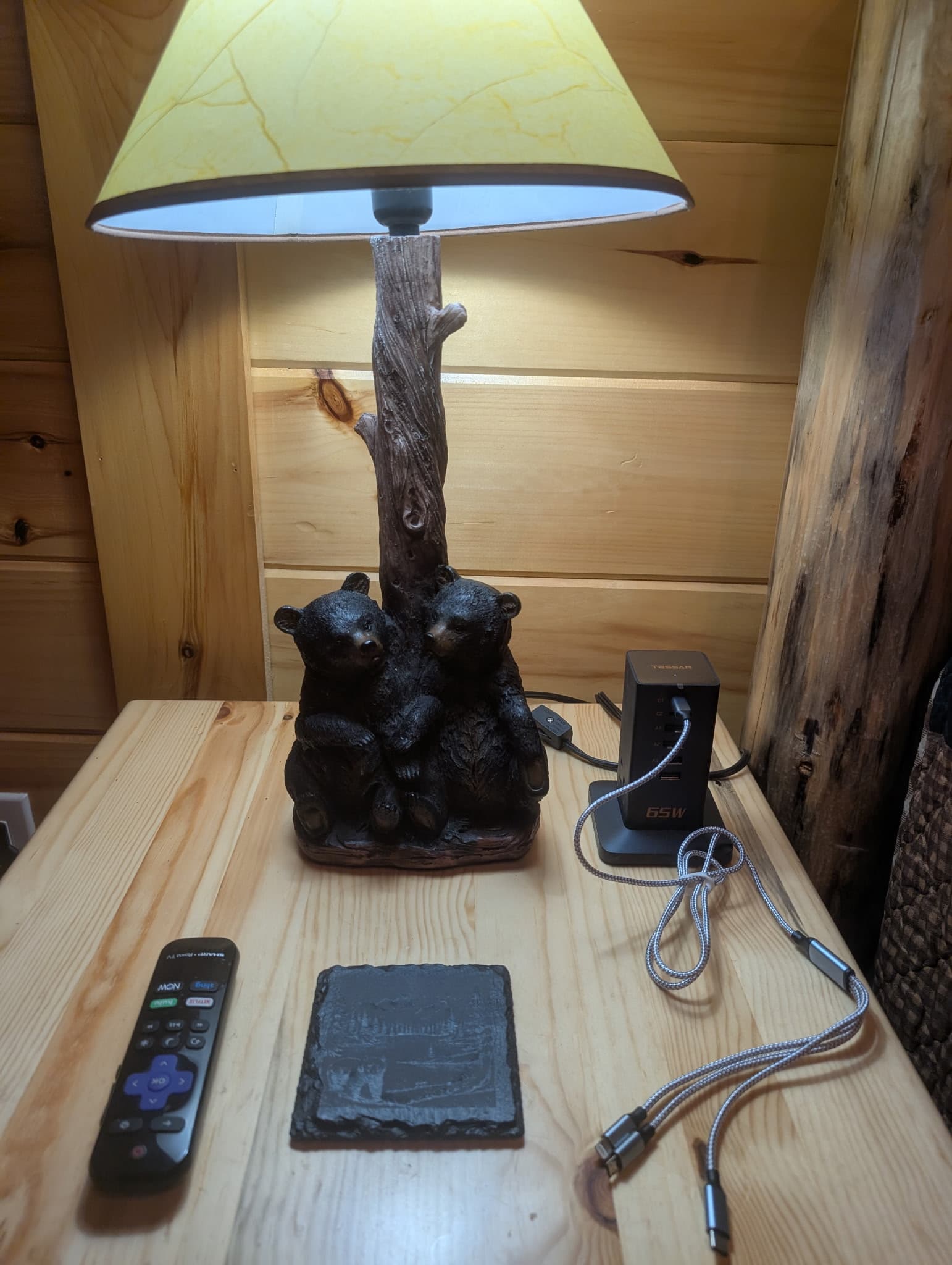 Rustic bear lamp detail in cabin interior