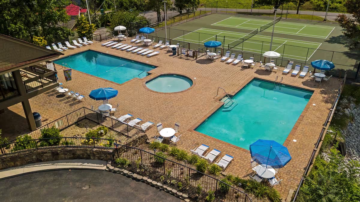 Double pool and tennis courts at Chalet Village